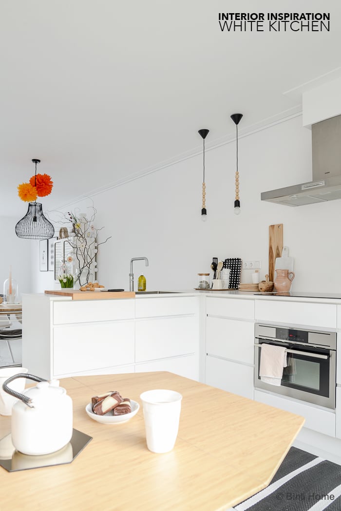 White kitchen with wooden details